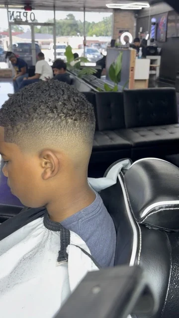 JT's Clips kids fade haircut at Alpha League Barbershop